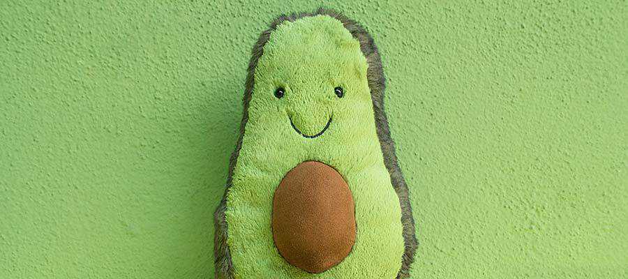 An avocado stuffed toy.