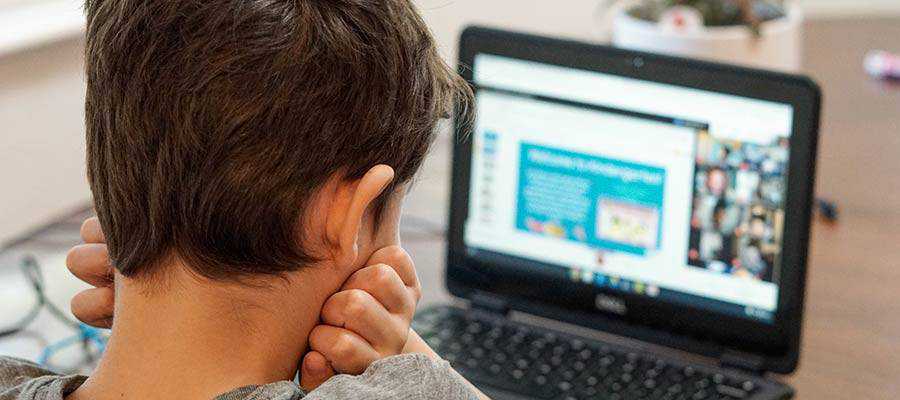 A child looking at a computer screen.