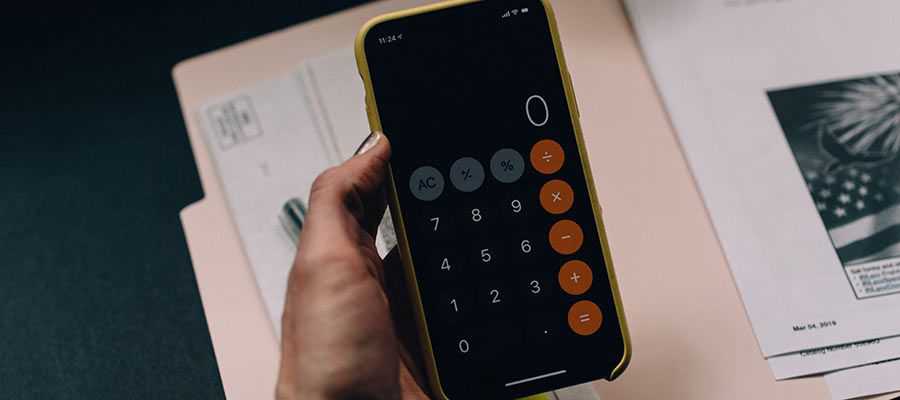 A person uses a calculator.